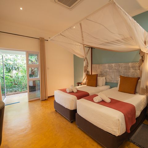 Schlafzimmer des Phezulu Gästehauses in Victoria Falls, Simbabwe